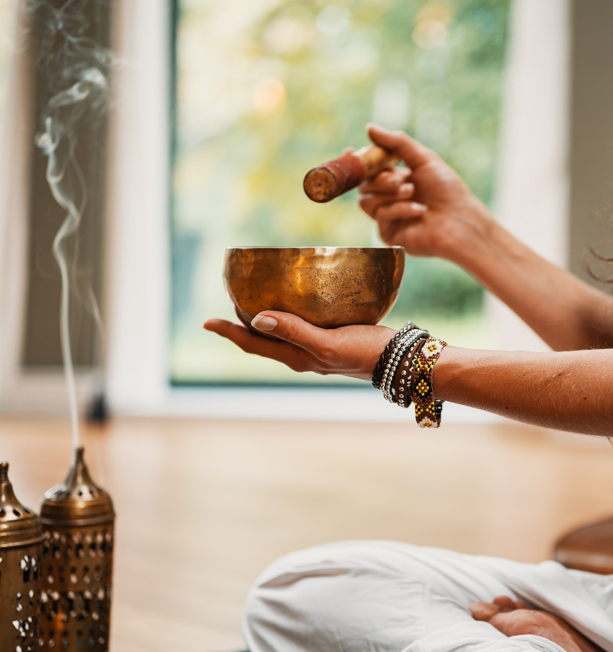 picture of person holding brass bowl